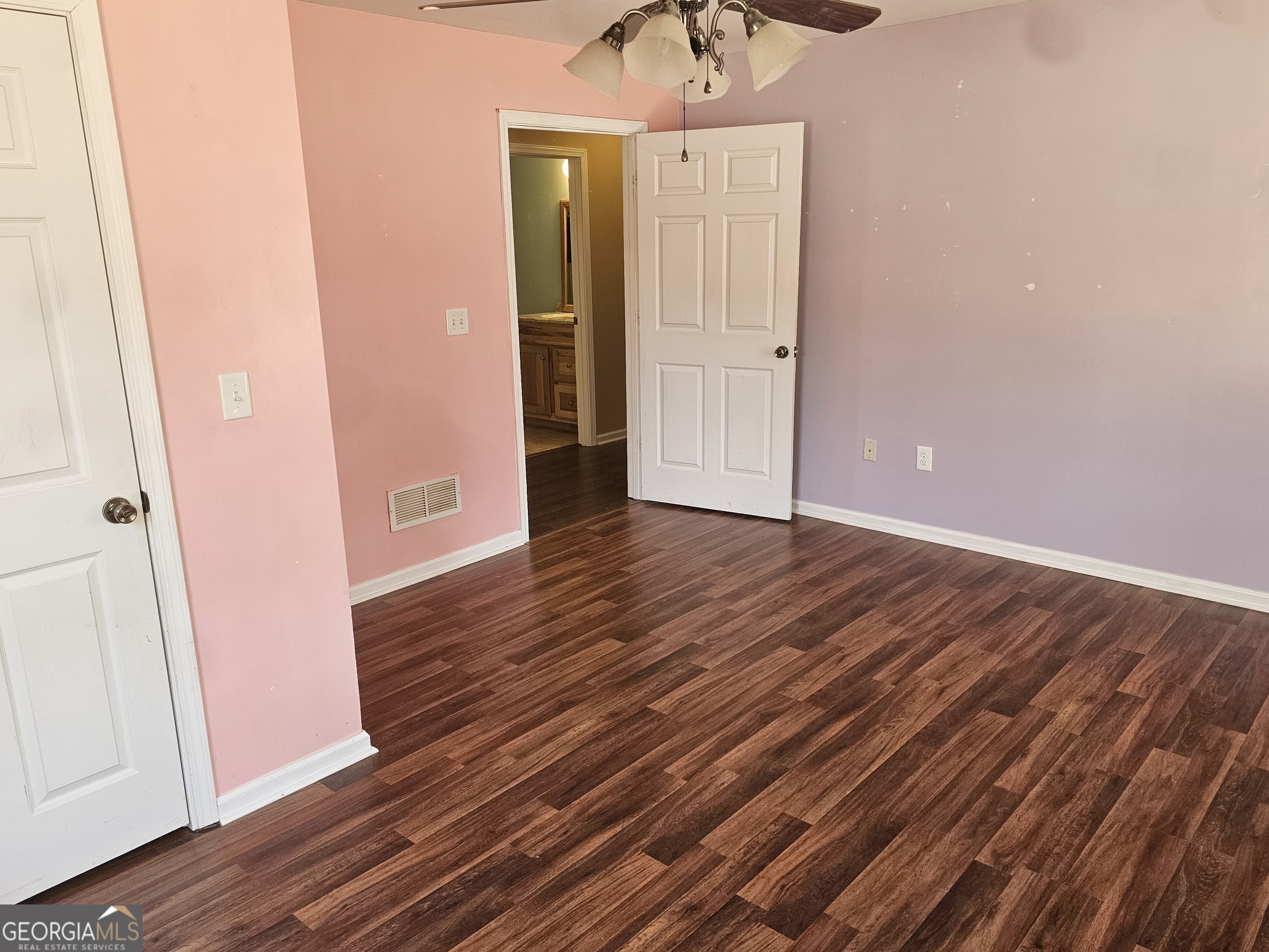 695 Frost Road Bowdon, GA 30108 - Photo 17 of 32 a view of a hallway with wooden floor