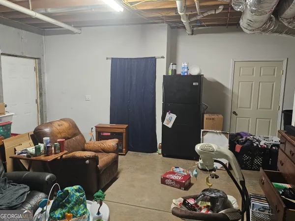 a bedroom with furniture and a chandelier