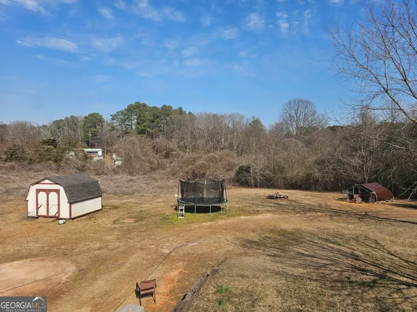 a view of a dry yard with mountain