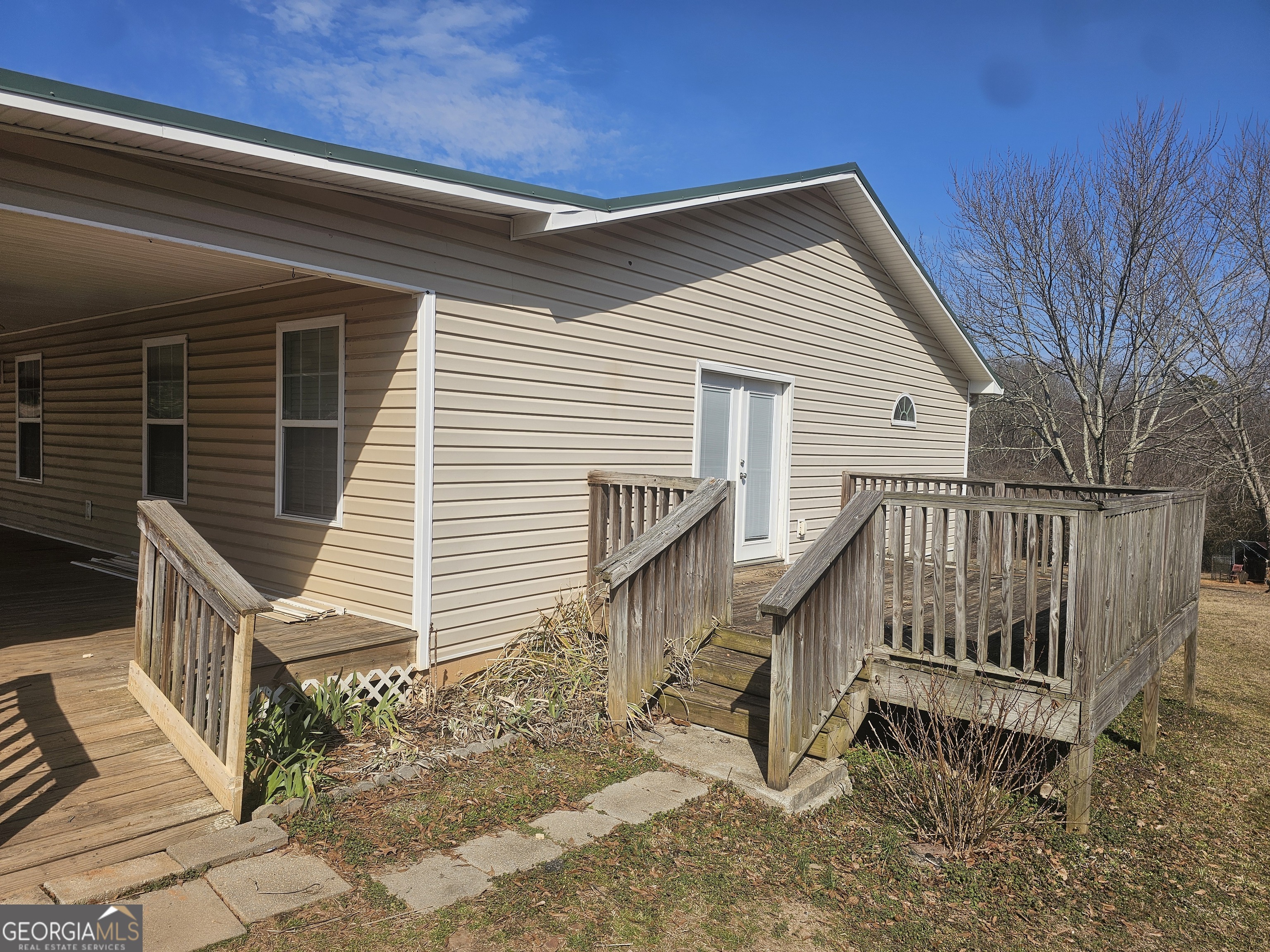 695 Frost Road Bowdon, GA 30108 - Photo 3 of 32 a view of a house with wooden fence
