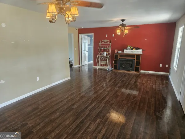 a view of a livingroom with wooden floor