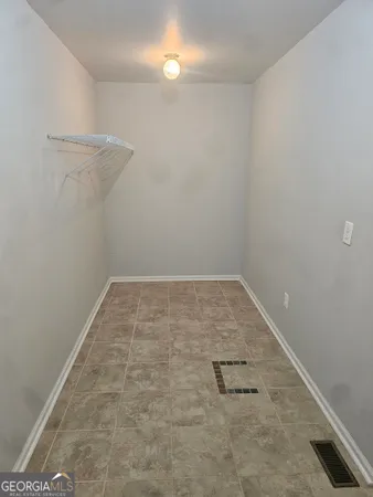 a view of a room with racks on the wall