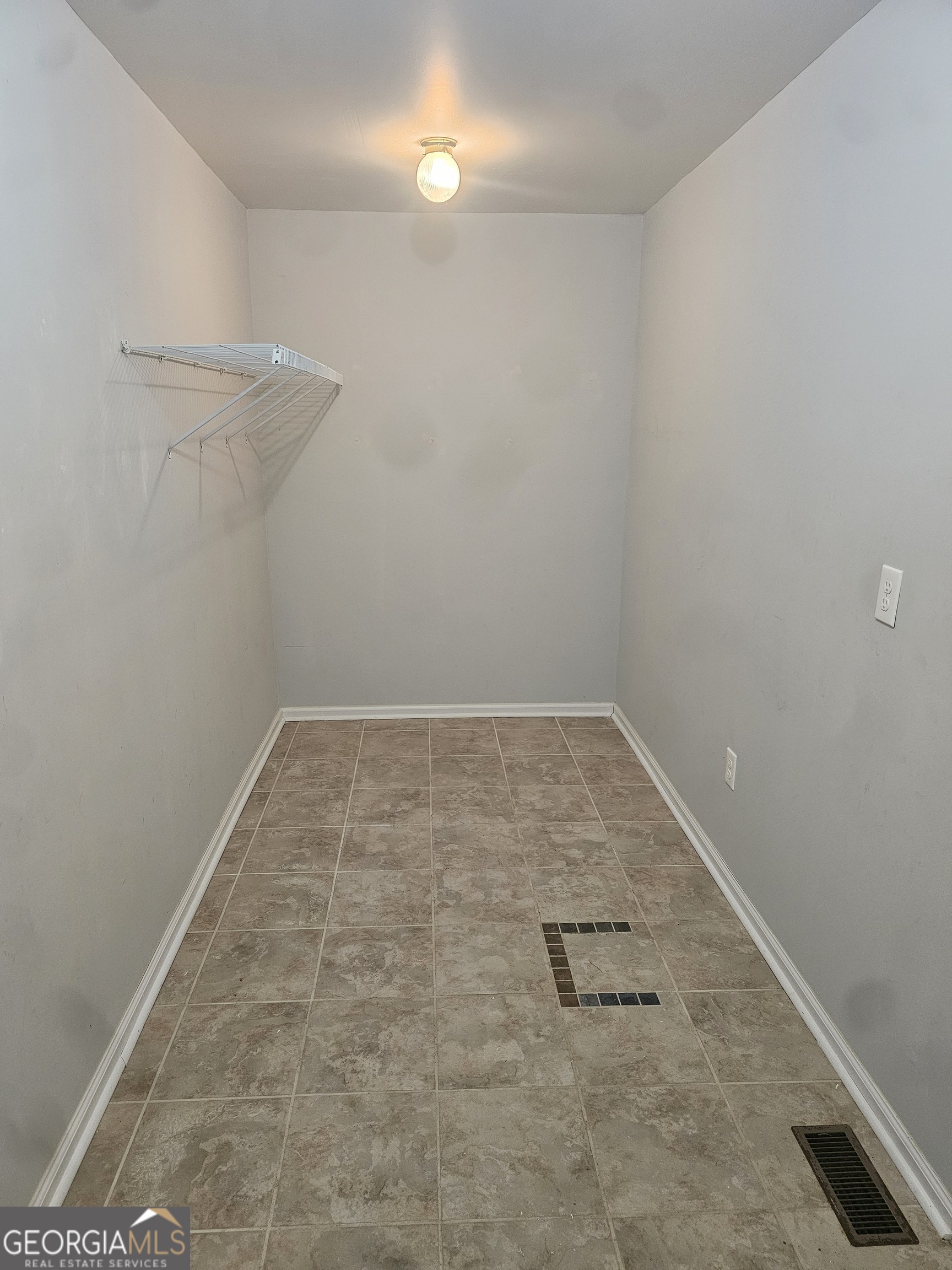 695 Frost Road Bowdon, GA 30108 - Photo 10 of 32 a view of a room with racks on the wall