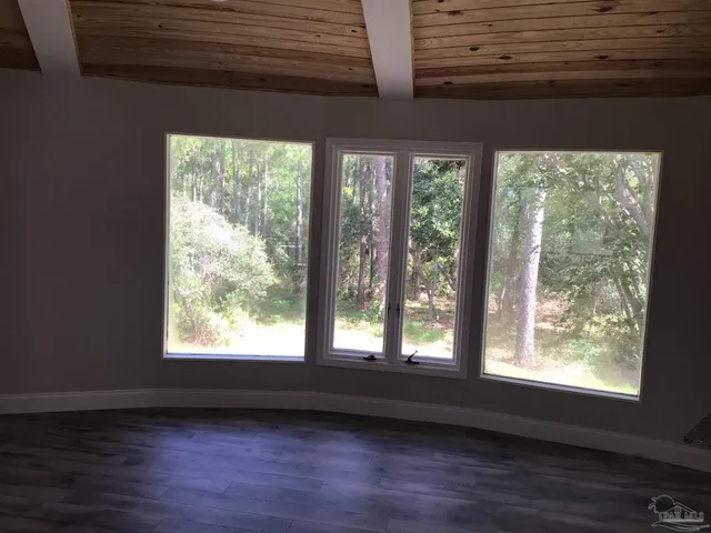 a backyard of a house with lots of green space