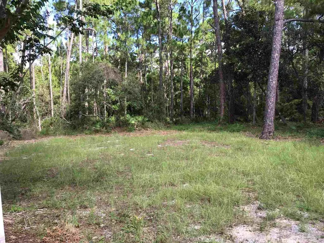 a view of balcony with deck and wooden floor