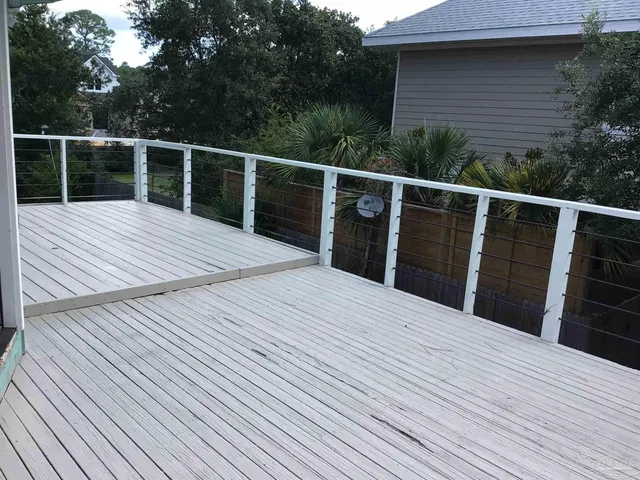 a bed sitting in a bedroom and wooden floor