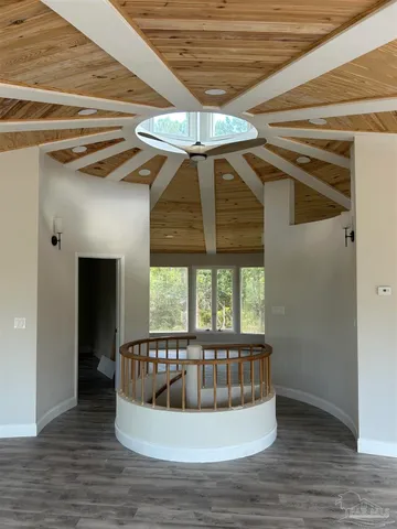 a view of a porch with a table and chairs
