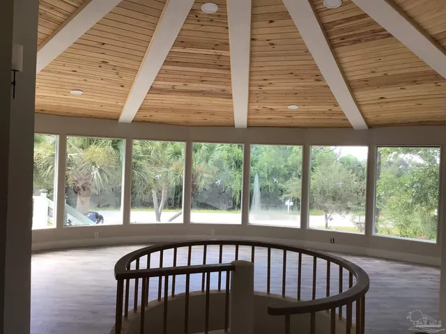a view of a balcony with furniture