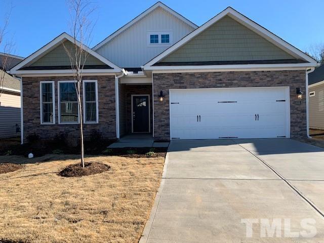 a backyard of a house with potted plants
