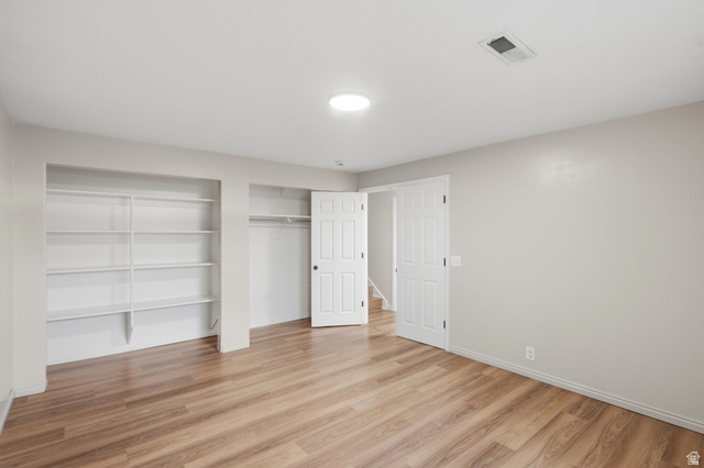 3732 Campbell Road Tooele, UT 84074 - Photo 35 of 69 Spacious room featuring wood-finish flooring and light-toned walls
