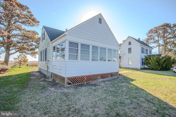 a backyard of a house with garden and deck