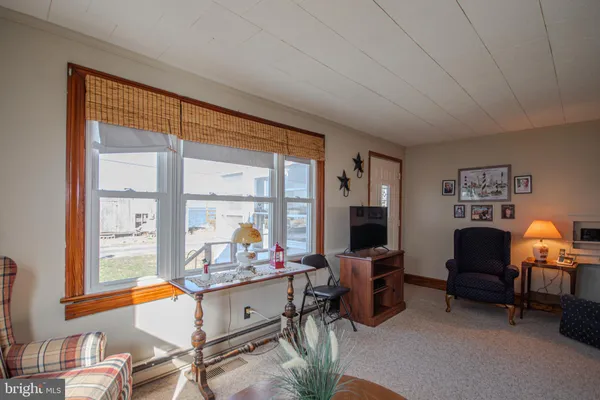 a room with furniture and a large window