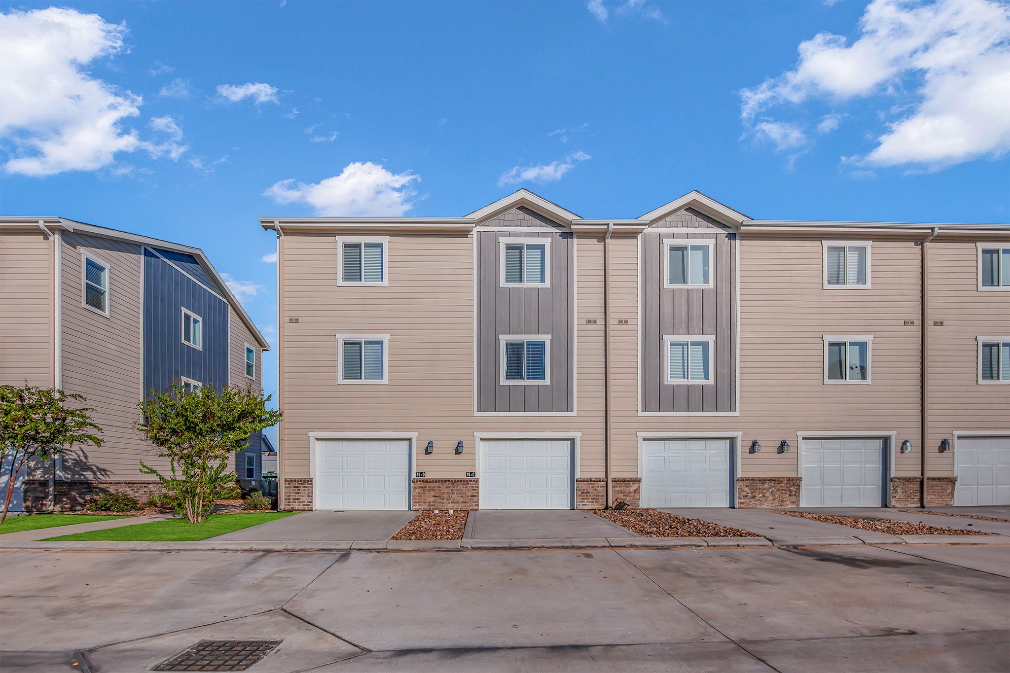 21155 Gosling Road, Unit 16B Spring, TX 77388 - Photo 16 of 16 a front view of a house with a yard and garage