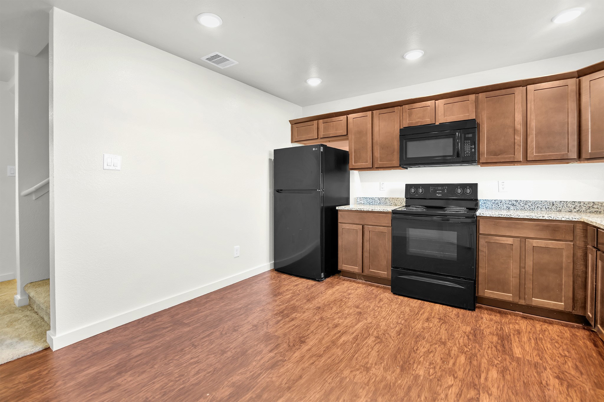 21155 Gosling Road, Unit 16B Spring, TX 77388 - Photo 8 of 16 a kitchen with a refrigerator stove and microwave