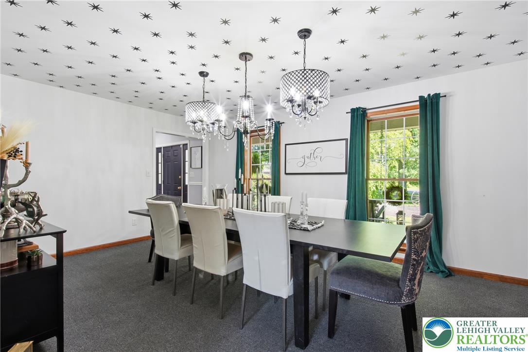 890 Lahr Road Nazareth, PA 18064 - Photo 10 of 71 Ornate chandeliers illuminate a well-lit dining area, perfect for intimate gatherings.