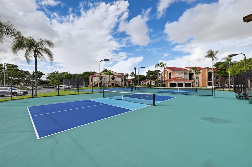 2011 Renaissance Boulevard, Unit 101 Miramar, FL 33025 - Photo 12 of 32 a swimming pool with outdoor seating and yard