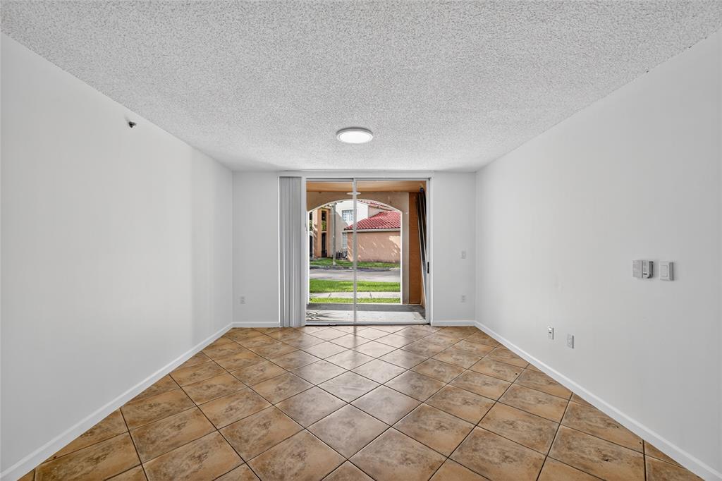 2011 Renaissance Boulevard, Unit 101 Miramar, FL 33025 - Photo 27 of 32 a view of an empty room and window