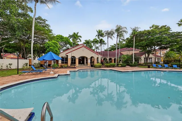 a aerial view of a house with swimming pool and deck