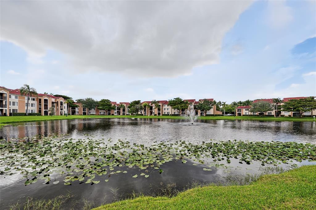 2011 Renaissance Boulevard, Unit 101 Miramar, FL 33025 - Photo 8 of 32 a view of a lake with houses in the back