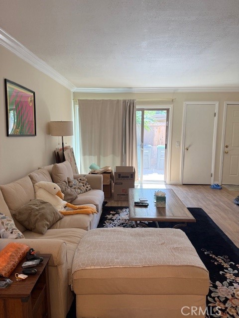 14172 Raintree Road Tustin, CA 92780 - Photo 14 of 27 a bedroom with a bed and wooden floor