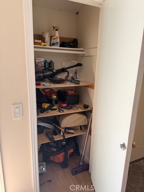 14172 Raintree Road Tustin, CA 92780 - Photo 17 of 27 a view of a hallway with shelf