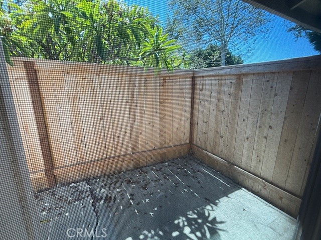 14172 Raintree Road Tustin, CA 92780 - Photo 20 of 27 a view of a wooden fence
