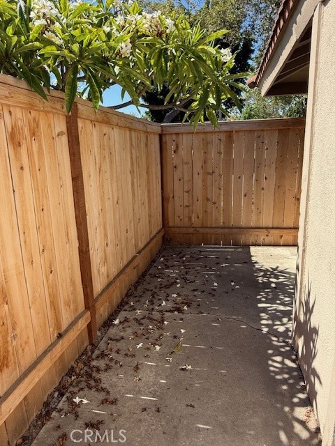 14172 Raintree Road Tustin, CA 92780 - Photo 21 of 27 a view of a backyard with wooden fence