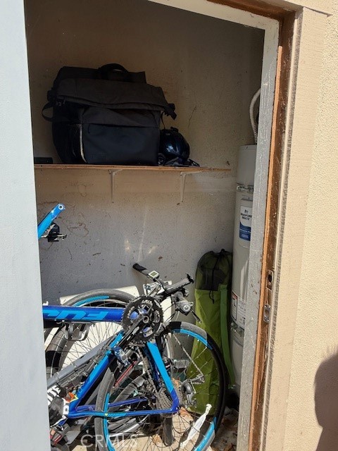 14172 Raintree Road Tustin, CA 92780 - Photo 22 of 27 a view of walk in closet with clothes