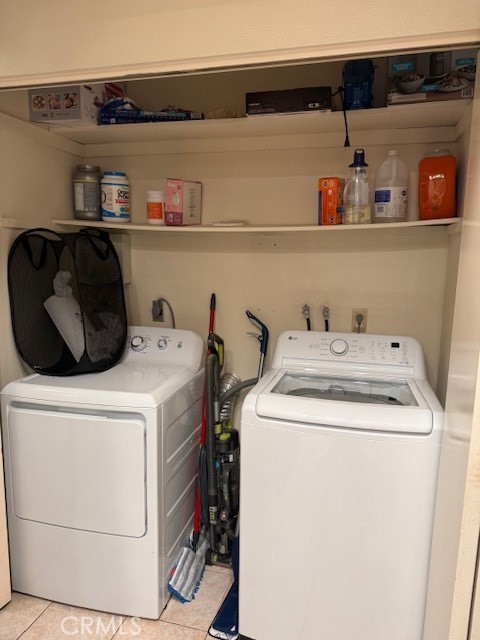 14172 Raintree Road Tustin, CA 92780 - Photo 25 of 27 a utility room with dryer and washer