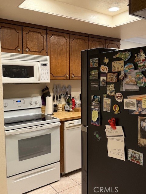 14172 Raintree Road Tustin, CA 92780 - Photo 26 of 27 a kitchen with stainless steel appliances granite countertop a stove and cabinets