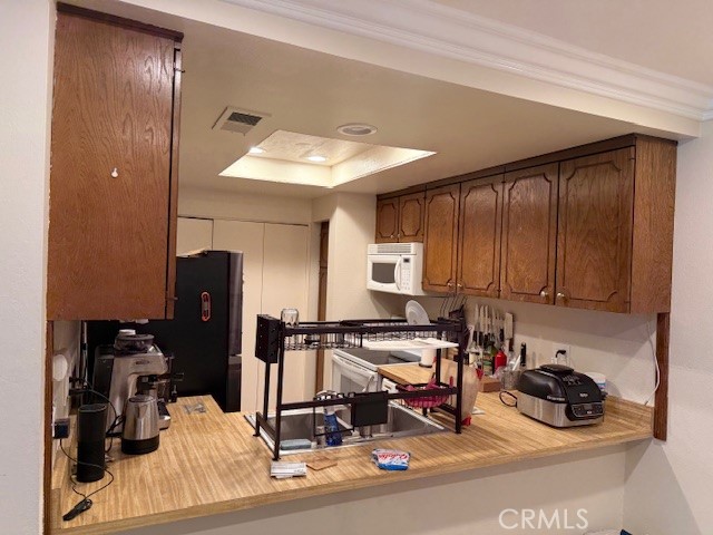 14172 Raintree Road Tustin, CA 92780 - Photo 27 of 27 a view of a workspace with furniture and a window