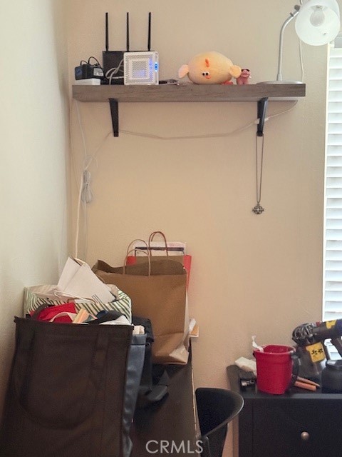 14172 Raintree Road Tustin, CA 92780 - Photo 7 of 27 a bedroom with a bed and cabinets