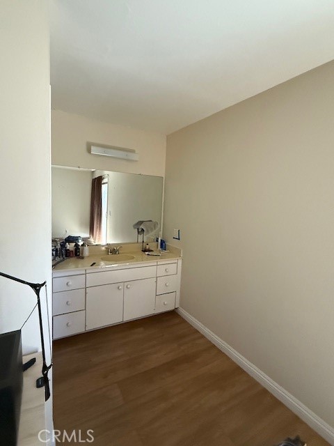 14172 Raintree Road Tustin, CA 92780 - Photo 9 of 27 a room with a chair and white cabinets