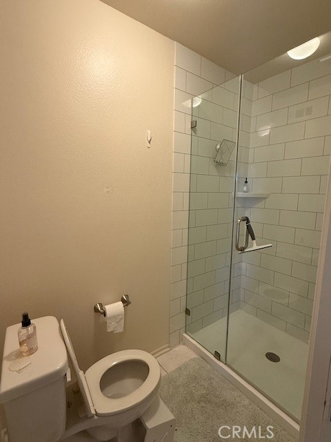14172 Raintree Road Tustin, CA 92780 - Photo 10 of 27 a bathroom with a toilet and a shower