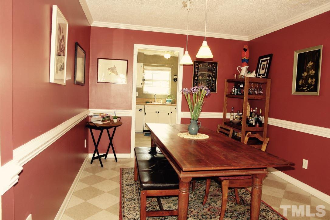 6451 New Market Way, Unit 6451 Raleigh, NC 27615 - Photo 4 of 15 Spacious Dining Room with access to the laundry area.
