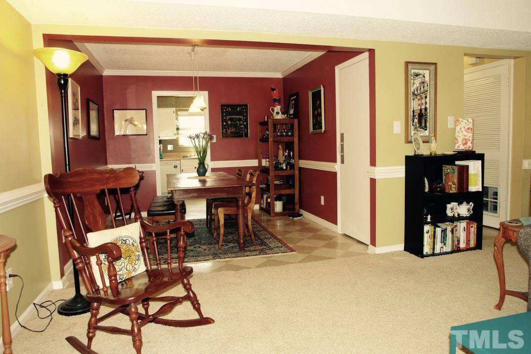 6451 New Market Way, Unit 6451 Raleigh, NC 27615 - Photo 5 of 15 Living Room and Dining Room are open to each other and present a beautiful flow between the two rooms.