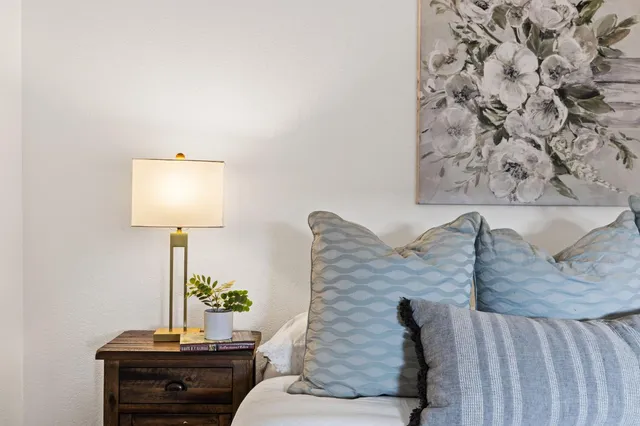 a living room with furniture and a lamp