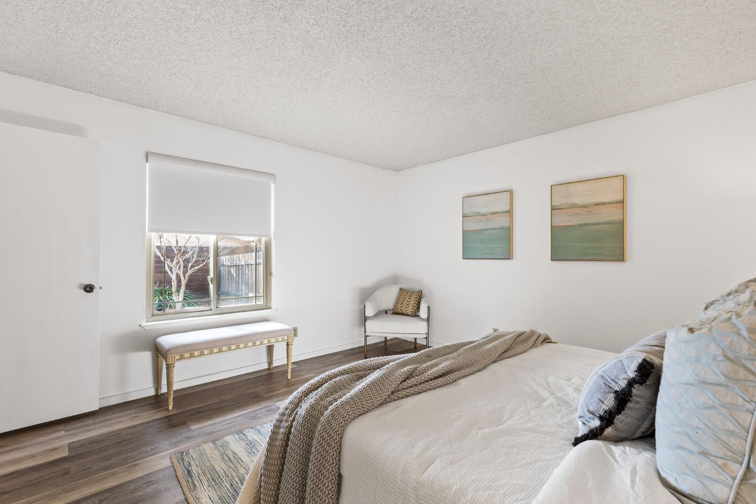 10938 Anza Way Rancho Cordova, CA 95670 - Photo 18 of 37 a bedroom with a bed and a window