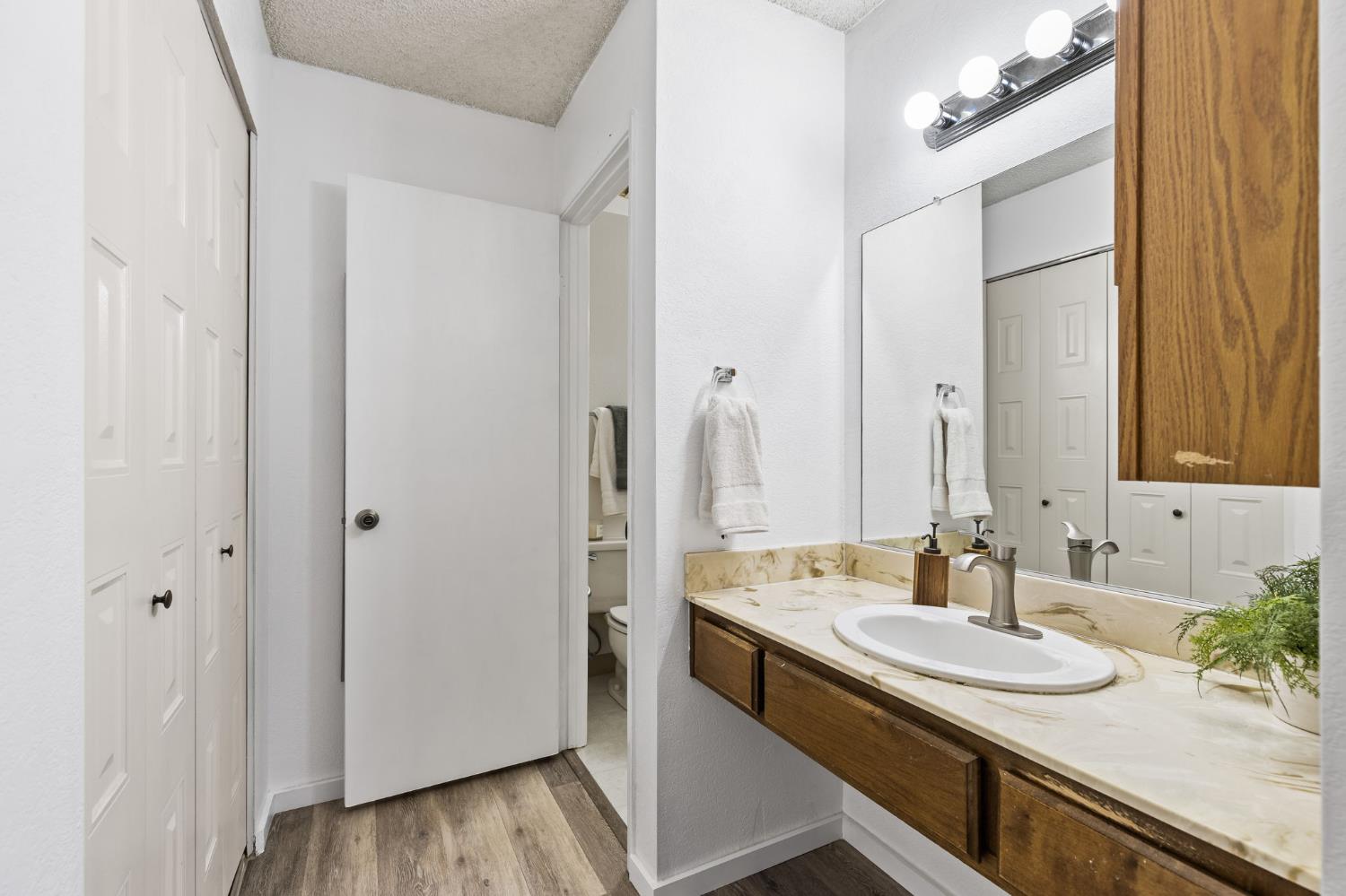 10938 Anza Way Rancho Cordova, CA 95670 - Photo 19 of 37 a bathroom with a sink and a mirror