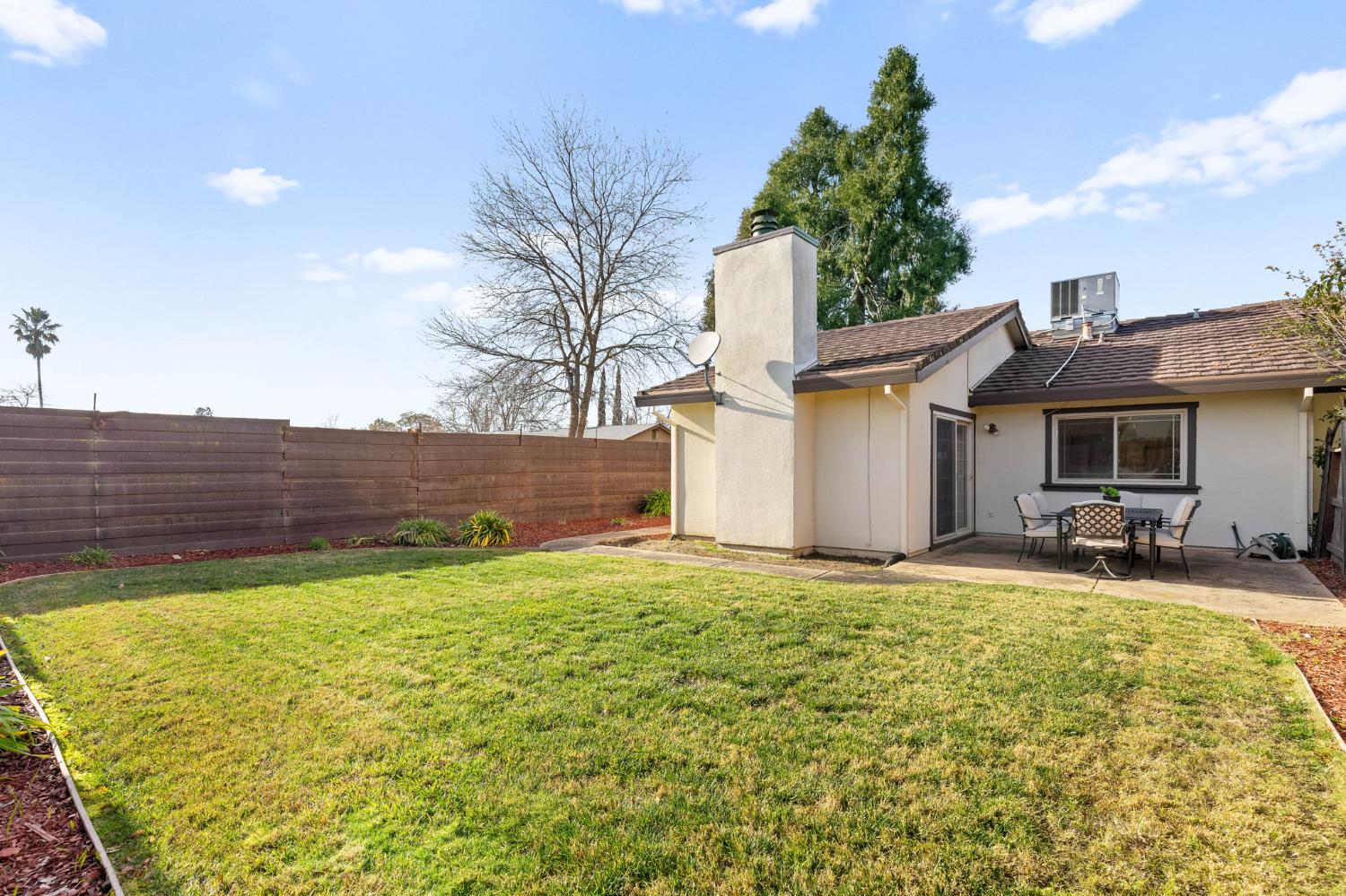 10938 Anza Way Rancho Cordova, CA 95670 - Photo 27 of 37 a view of a house with backyard and sitting area