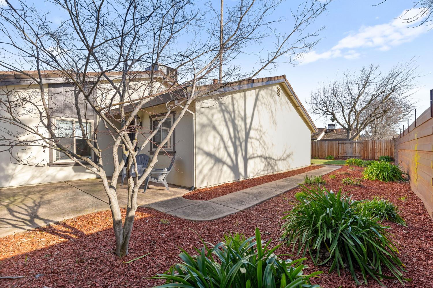 10938 Anza Way Rancho Cordova, CA 95670 - Photo 34 of 37 a backyard of a house with lots of green space