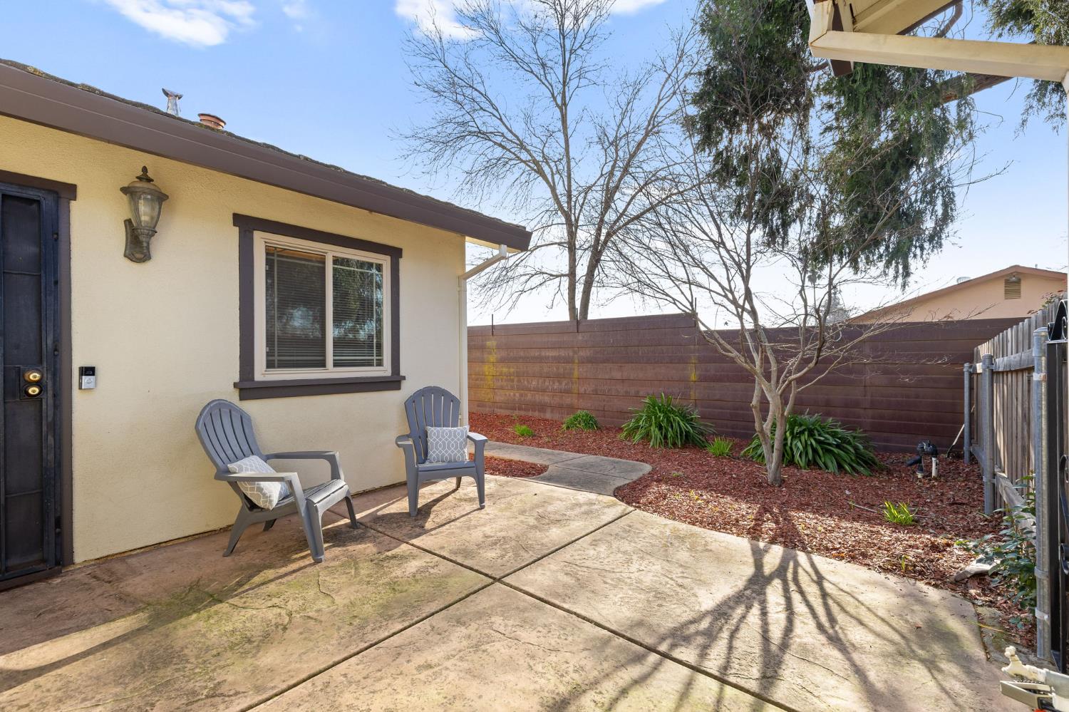 10938 Anza Way Rancho Cordova, CA 95670 - Photo 36 of 37 a backyard of a house with table and chairs