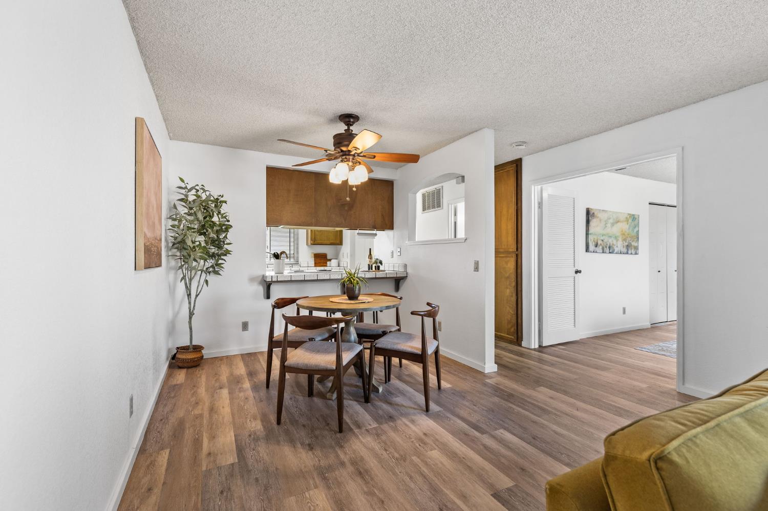 10938 Anza Way Rancho Cordova, CA 95670 - Photo 7 of 37 a view of a livingroom with furniture and wooden floor