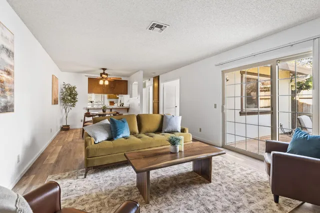 a living room with furniture and a large window
