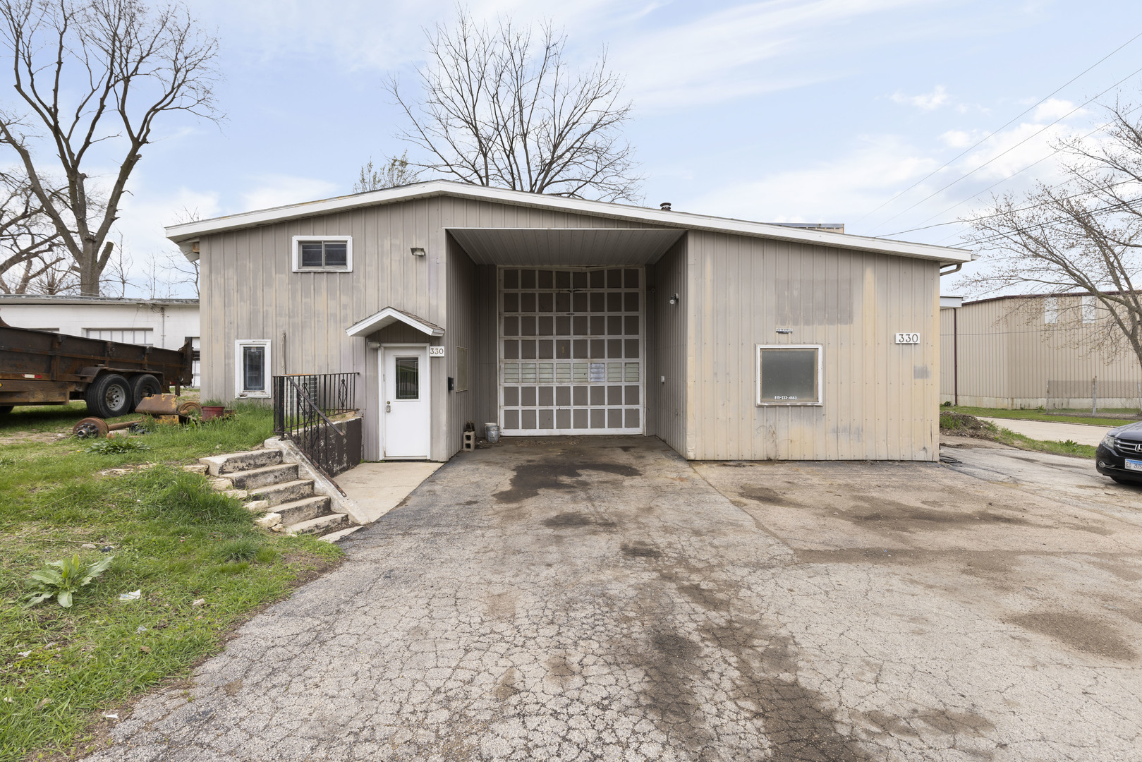 330 East Winslow Street Freeport, IL 61032 - Photo 1 of 15 a view of a house with a yard and garage