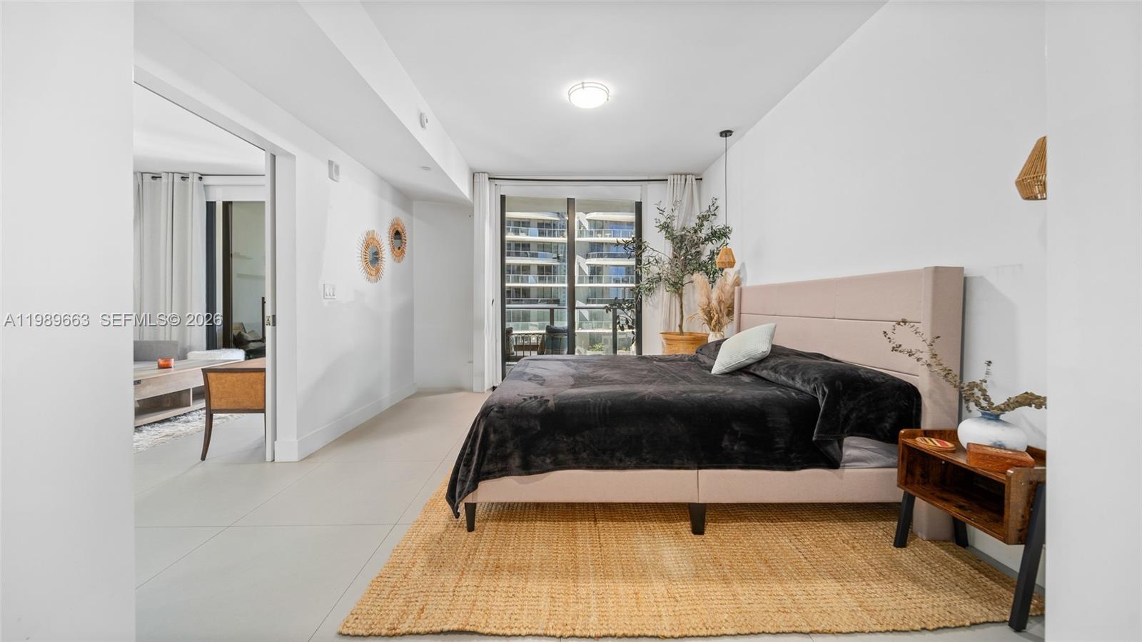 1010 Brickell Avenue, Unit 2008 Miami, FL 33131 - Photo 12 of 26 a bedroom with a bed and window