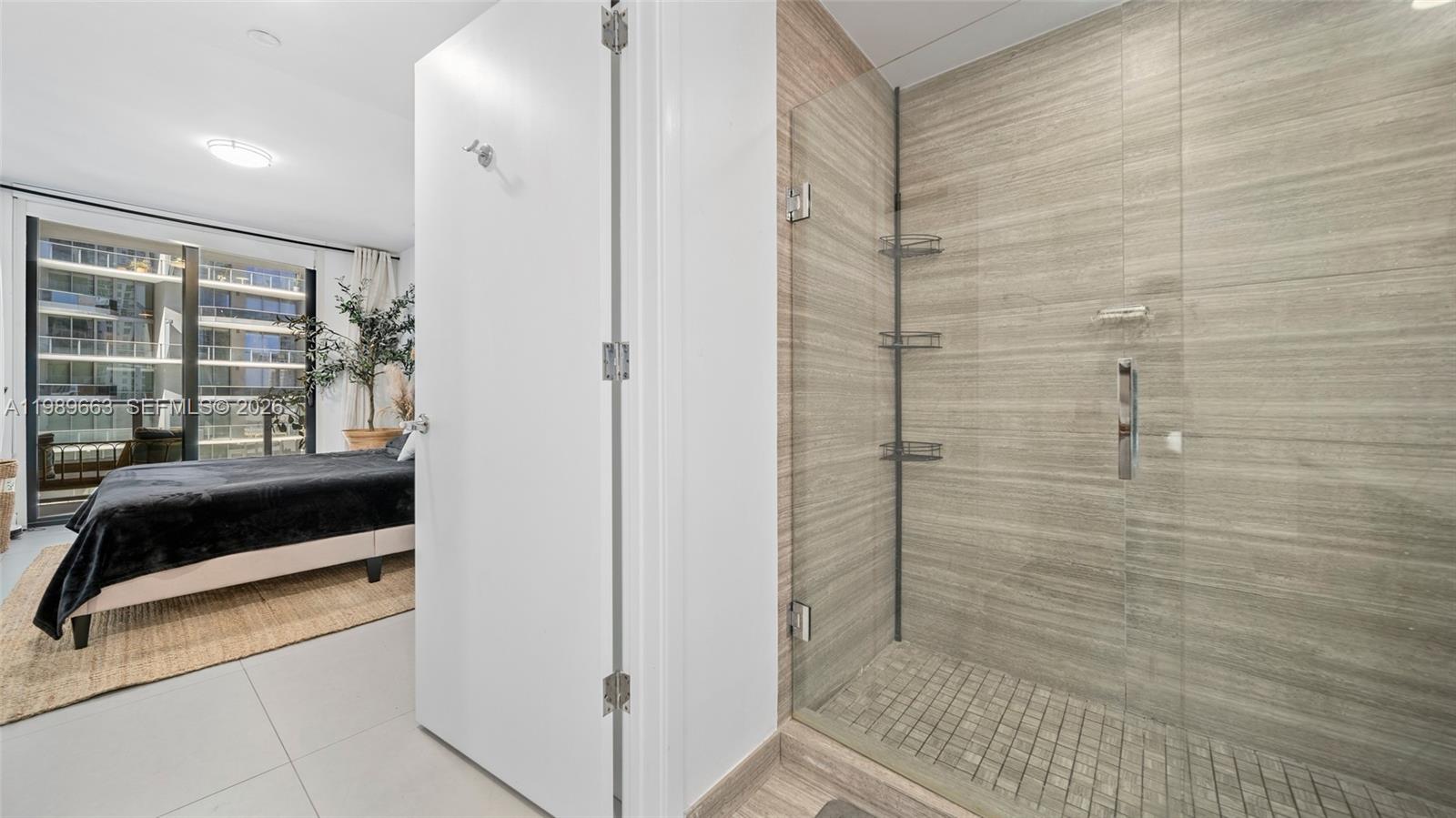 1010 Brickell Avenue, Unit 2008 Miami, FL 33131 - Photo 17 of 26 a bathroom with a sink and a shower