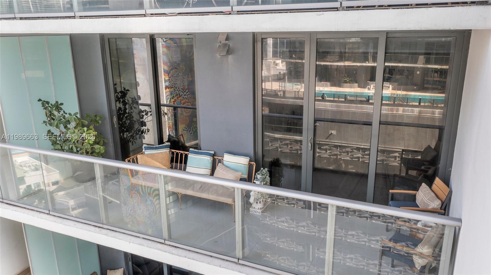 1010 Brickell Avenue, Unit 2008 Miami, FL 33131 - Photo 18 of 26 a view of a balcony with a potted plant