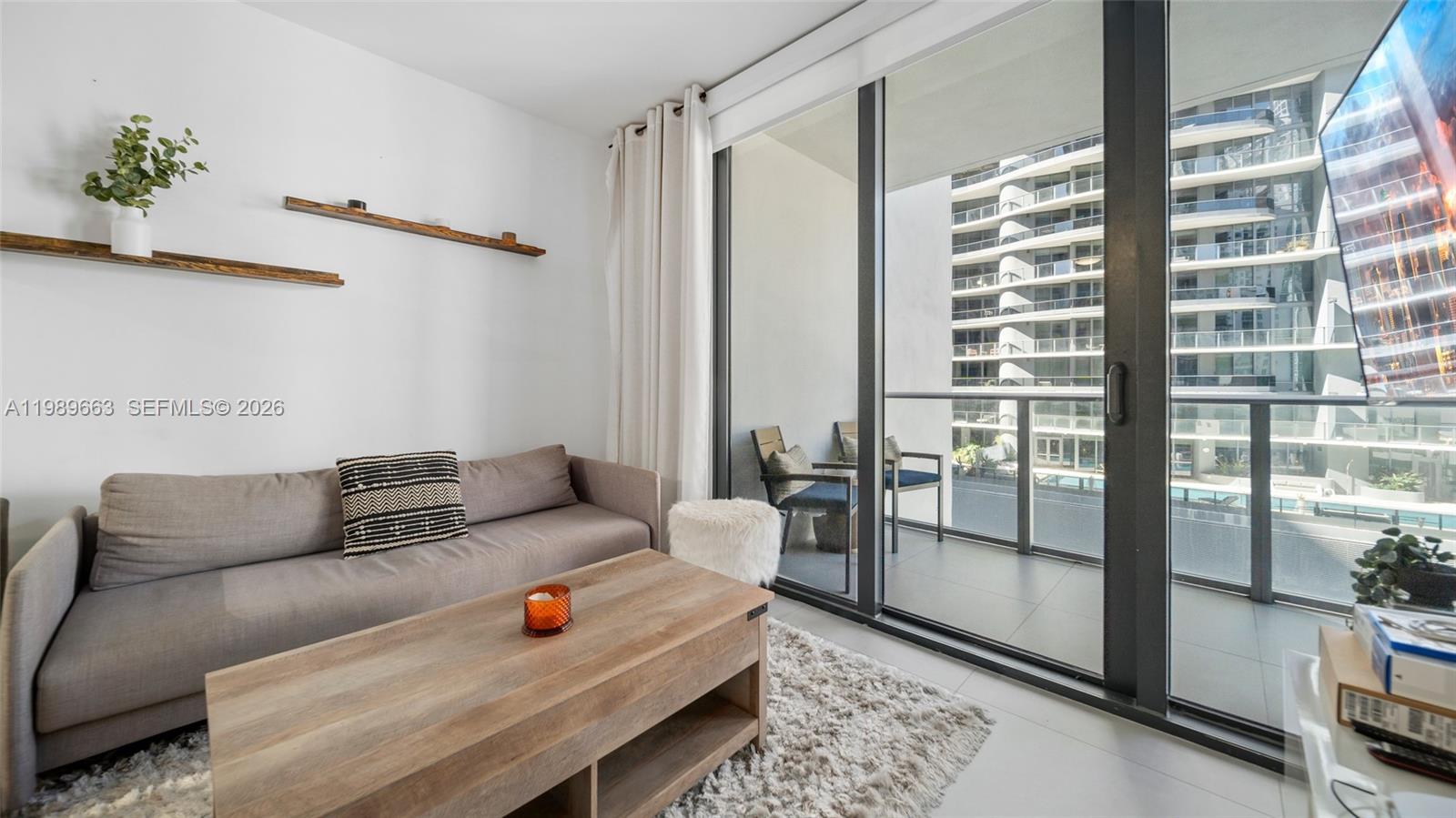 1010 Brickell Avenue, Unit 2008 Miami, FL 33131 - Photo 9 of 26 a living room with furniture