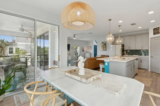 a large kitchen with a table and chairs